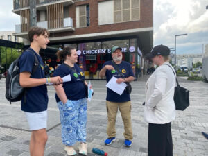 3 missionaries share the gospel with a woman on the streets of Paris